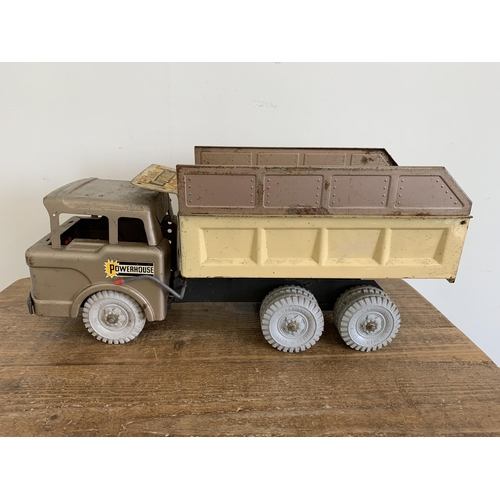 79 - A vintage Louis Marx & Co tin plate hydraulic dump truck, 20