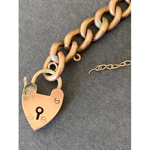 116 - A 9ct rose gold heart shaped locket on a rose coloured chain bracelet, each link is marked '9' or '6... 