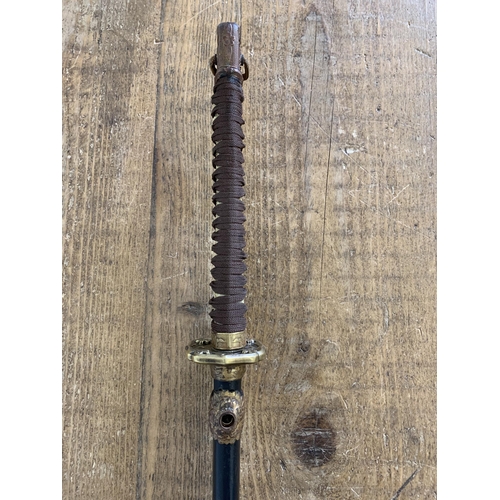 335 - A WW2 Japanese Katana in scabbard (possible rebound handle, ring loop missing on scabbard)