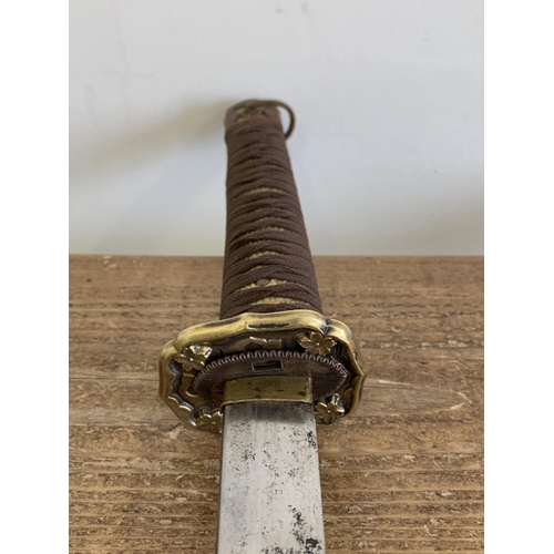 335 - A WW2 Japanese Katana in scabbard (possible rebound handle, ring loop missing on scabbard)