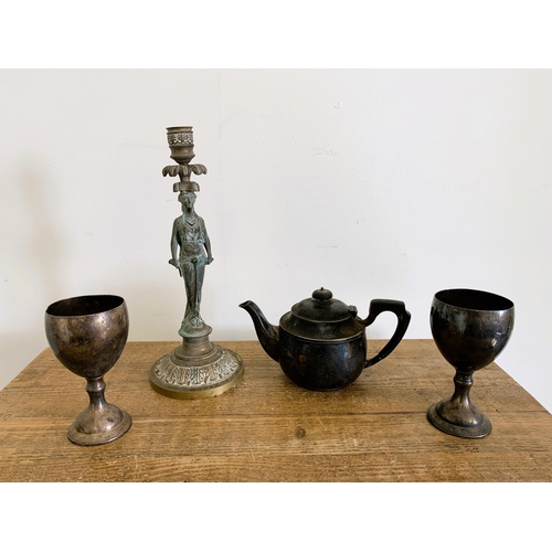 100 - An Elkington silver plated teapot plus two plated goblets and a brass classical figure candlestick, ... 