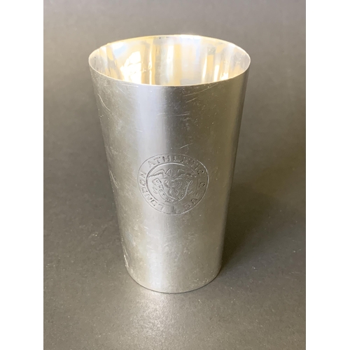 135 - A hallmarked silver award beaker, bears emblem for London Athletics Club and engraved 'P J Firmin Tr... 