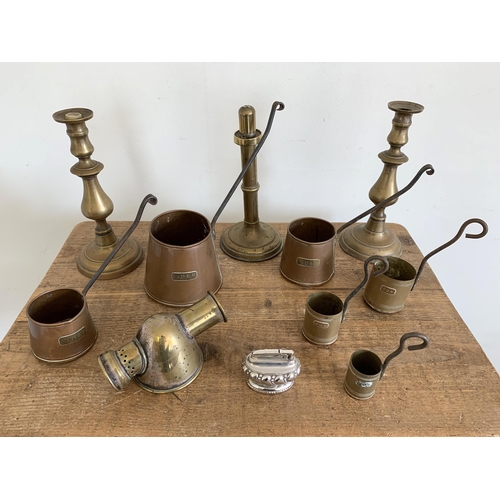 144 - Mixed brassware including copper cider measures, brass candlesticks etc