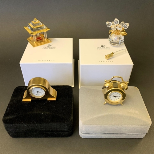 155 - Two boxed Swarovski crystal 'Journeys' and Memories plus two boxed miniature clocks