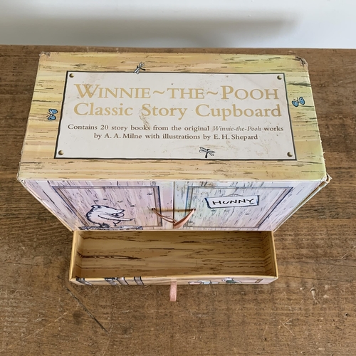 181 - Winnie-the-Pooh Classic Story Cupboard storage chest of twenty A.A.Milne story books (some storage d... 