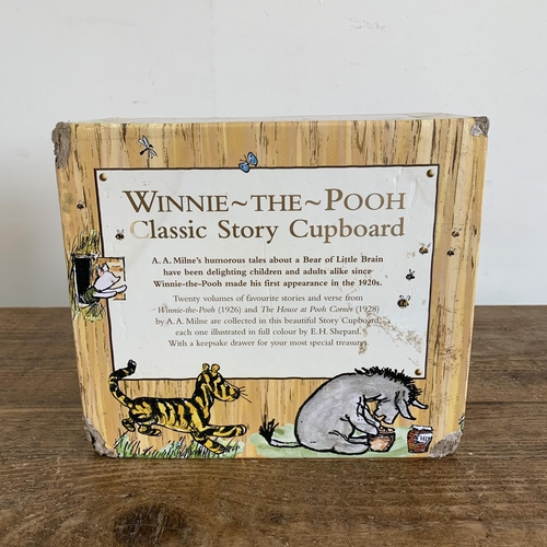 181 - Winnie-the-Pooh Classic Story Cupboard storage chest of twenty A.A.Milne story books (some storage d... 