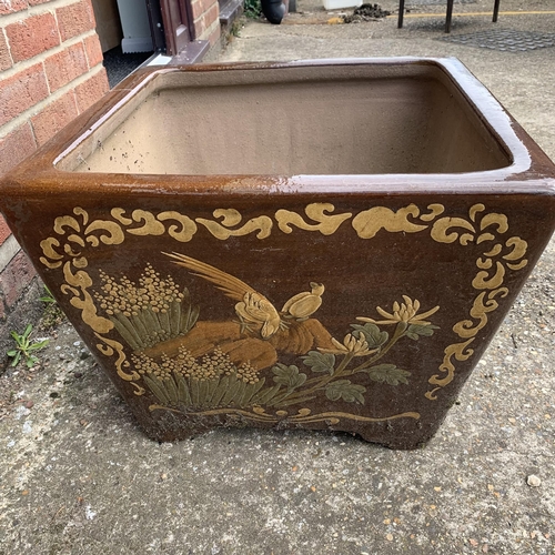 198 - A heavy large garden planter decorated on each side with  different Oriental animals, 21