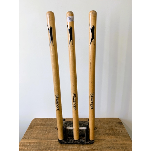 202 - A set of Slazenger spring cricket stumps, 28