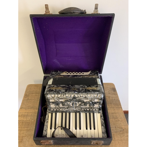 215 - A vintage cased 'Royal Artist' accordion (signs of use and wear)