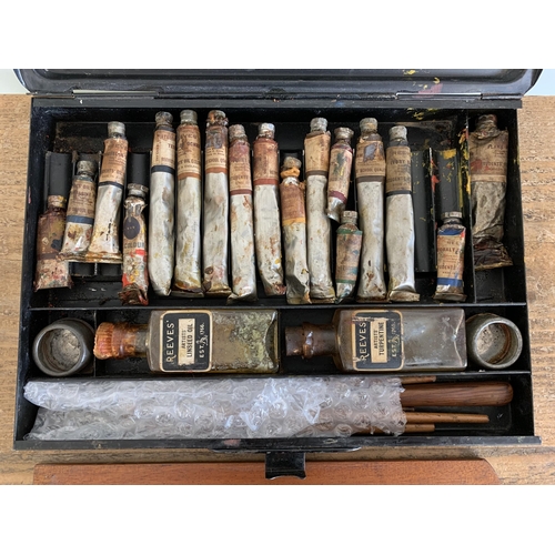 223 - A vintage 'Reeves' metal case artists set with old oils and wood palette and brushes together with a... 