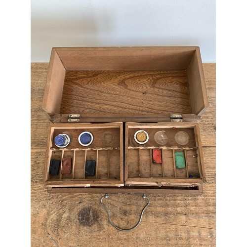 223 - A vintage 'Reeves' metal case artists set with old oils and wood palette and brushes together with a... 