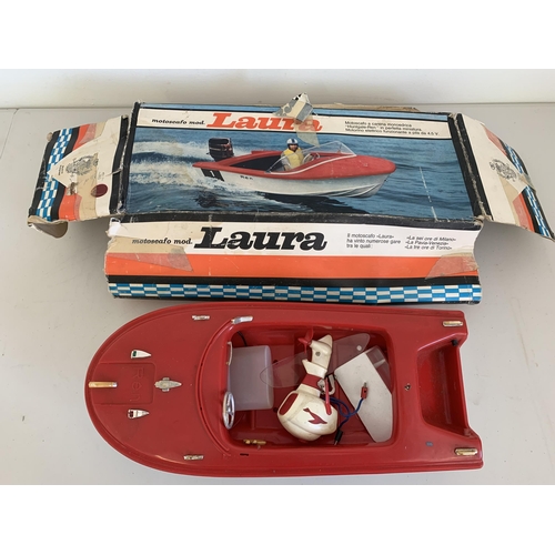 23 - A boxed vintage Italian 'Motoscafo Mod Laura' battery operated plastic boat, 15 1/2