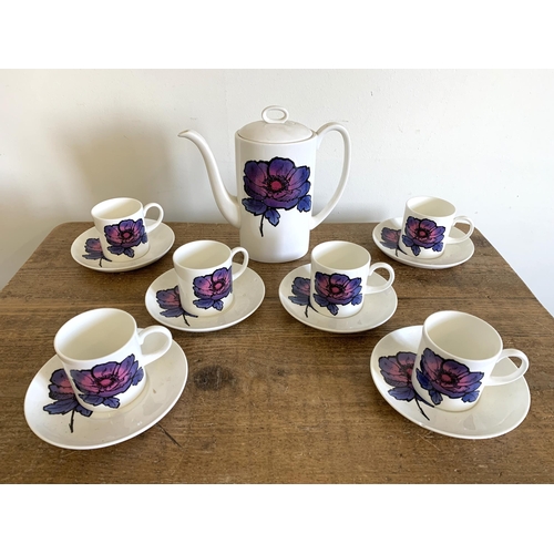 240 - A Wedgwood Susie Cooper design 'Blue Anemone' six setting coffee set (one saucer chipped)