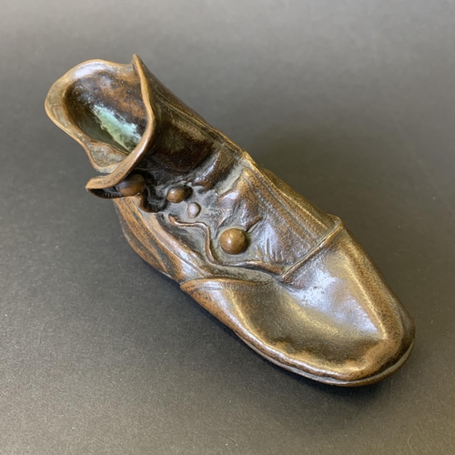 247 - An antique bronze folded over childs size ankle boot/shoe, 4 1/2