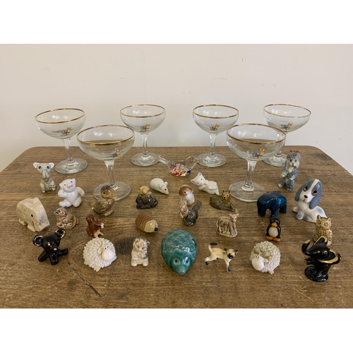 259 - Six vintage Babycham glasses plus a collection of small animal figures including Wade Whimsies