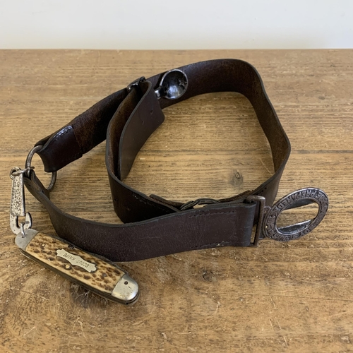 284 - A vintage Boys Scouts leather belt and buckle marked 'Be Prepared' with attached 'scout knife', mult... 