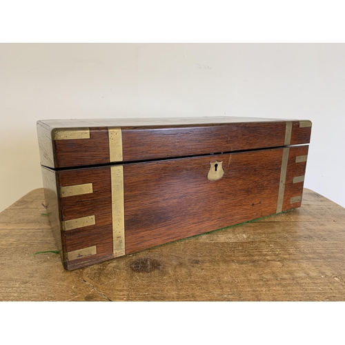 302 - A large brass banded mahogany writing/travelling box, interior with replacement leather, 17 1/2