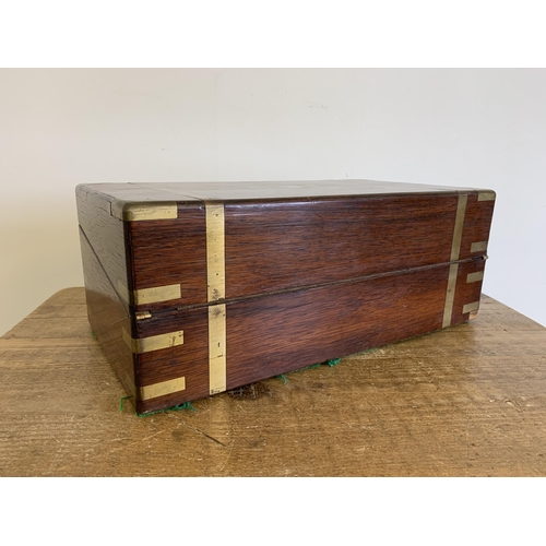 302 - A large brass banded mahogany writing/travelling box, interior with replacement leather, 17 1/2