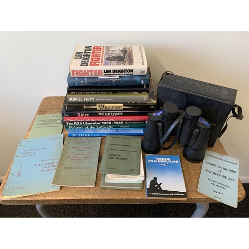 306 - A box of military books plus a pair of binoculars