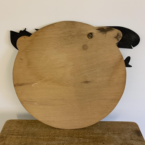 312 - A round wall mirror with cut out wood aeroplane attached, 24