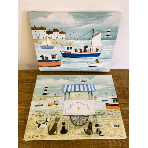 317 - Two canvas prints of seaside scenes with dogs, 15 3/4