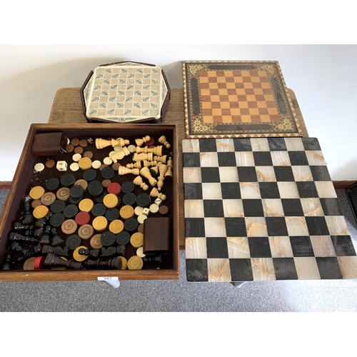 327 - A stone chess board plus a boxed chess set, a loose chess set, wooden board etc