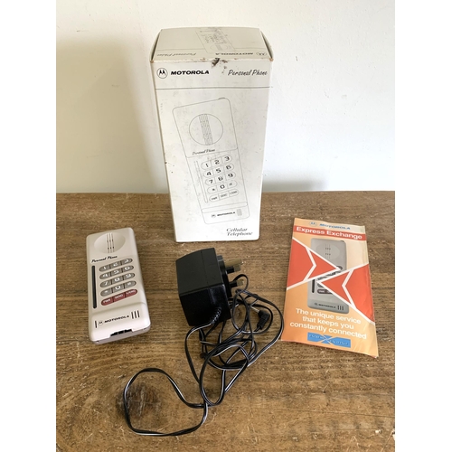 333 - A circa 1994 boxed Motorola personal phone with paperwork (signs of use)