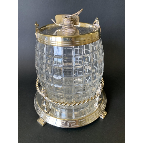 344 - A vintage silver plate and cut glass biscuit barrel on stand finished with a coiled rope handle (wea... 