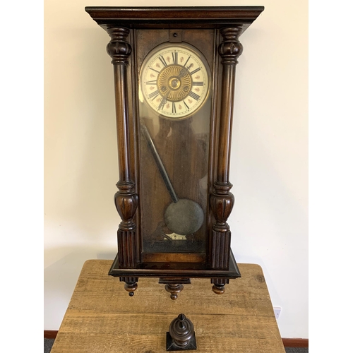 350 - A mahogany cased antique Vienna wall clock with pendulum and two keys, approx. 33