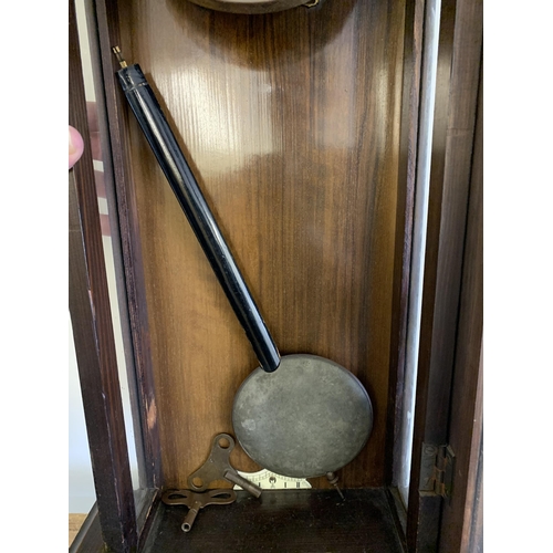 350 - A mahogany cased antique Vienna wall clock with pendulum and two keys, approx. 33