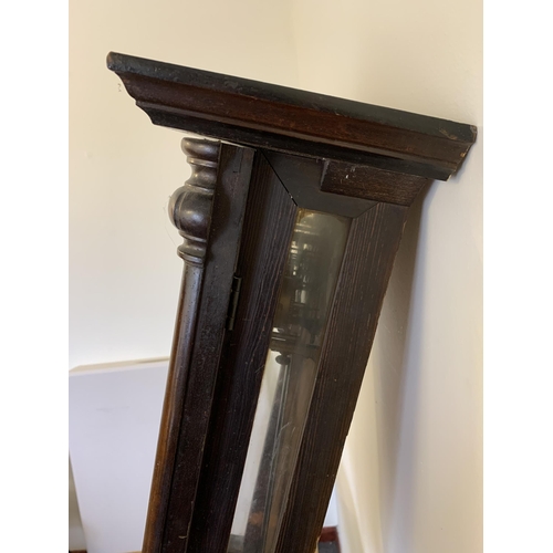 350 - A mahogany cased antique Vienna wall clock with pendulum and two keys, approx. 33