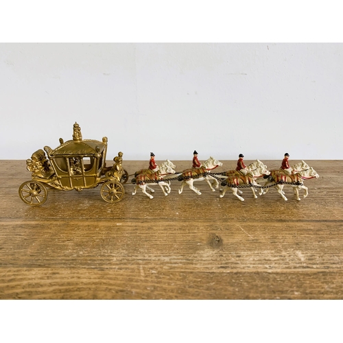 36 - A vintage miniature Coronation coach with lead figures