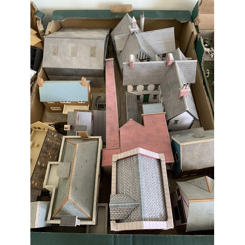 40 - A large collection over three boxes of model buildings for railway dioramas etc, most are card const... 