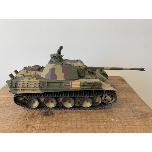 57 - A 'Taigen' self assembly radio controlled die cast tank with controller, approx. 21 1/2