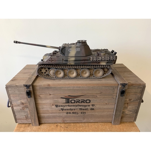 58 - A 'Torro' radio controlled die cast Panther tank with wooden box and controller, approx. 22