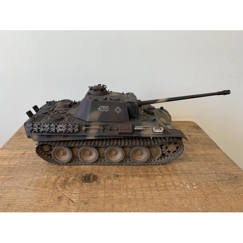 58 - A 'Torro' radio controlled die cast Panther tank with wooden box and controller, approx. 22