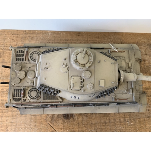 59 - A 'Torro' radio controlled die cast King Tiger tank with wooden box and controller, approx. 25