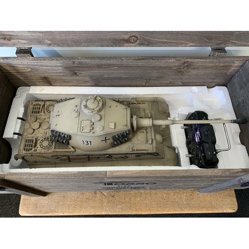 59 - A 'Torro' radio controlled die cast King Tiger tank with wooden box and controller, approx. 25