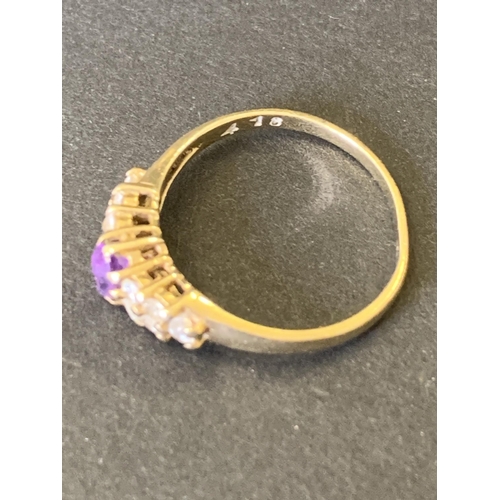 96 - A 9ct gold and amethyst with white stone ring, approx. size J 1/2, weight approx. 1.4g (band misshap... 