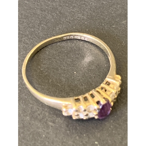 96 - A 9ct gold and amethyst with white stone ring, approx. size J 1/2, weight approx. 1.4g (band misshap... 