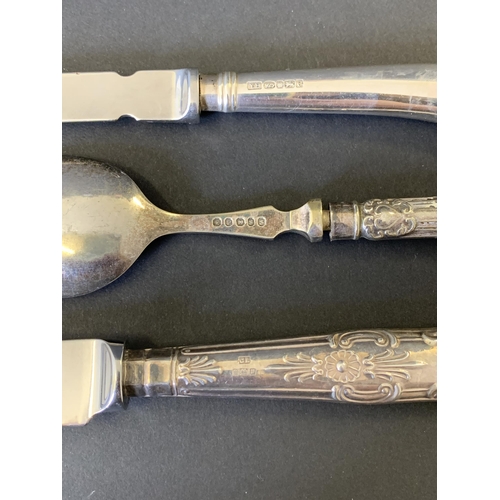 119 - A 925 sterling handle letter opener, a hallmarked silver handle cheese knife and a white metal handl... 