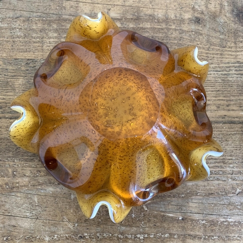 14 - Two vintage Murano glass bowls, a cream and amber Floriform Art glass example and a heavy facet cut ... 