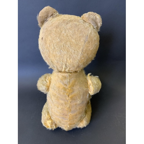 211 - A vintage mohair teddy bear with jointed limbs, glass eyes and leather pads, approx. 19