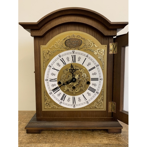 27 - A wooden cased mantel clock converted to battery, German face, 12 1/2