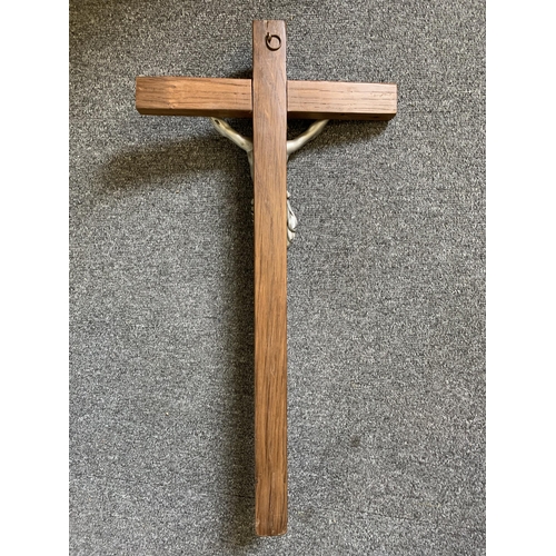 31 - A large wood and metal crucifix, inset plaque states 'This wood is at least 500 years old and at one... 