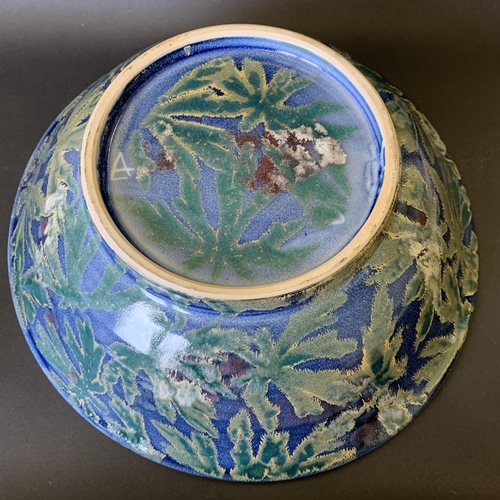 42 - A large possibly Dartington ceramic bowl decorated in a leaf pattern, 13 1/2