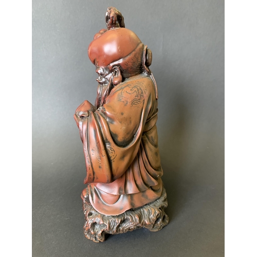 44 - A heavy resin Chinese immortal figurine, 10