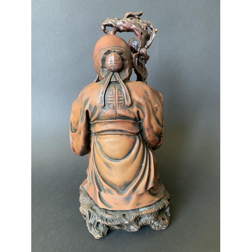 44 - A heavy resin Chinese immortal figurine, 10