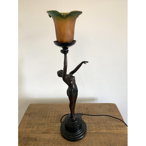 57 - A vintage resin Art Deco style semi clad lady table lamp with glass shade, approx. 25