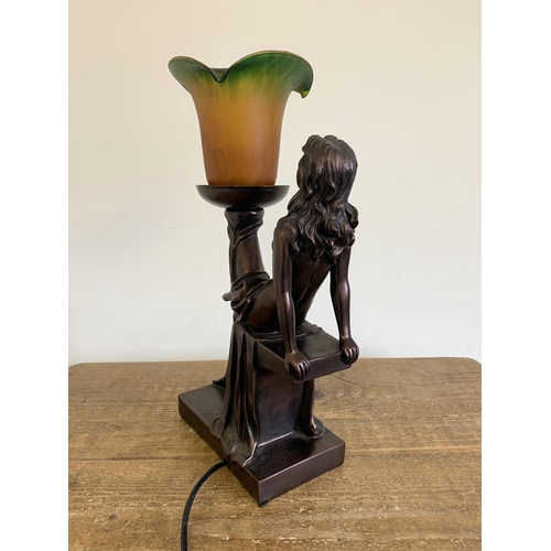 59 - A vintage resin Art Deco style semi clad lady table lamp with glass shade, approx. 17 1/4